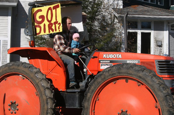 Hydroponics Got Dirt protest photo tractor with baby